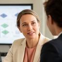 Gigi Finky, database security consultant, discussing access controls with a colleague